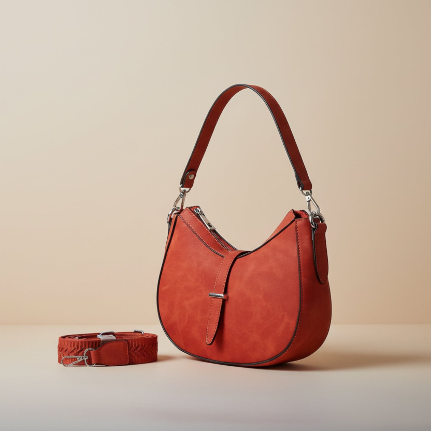 BORSA A MEZZALUNA SCAMOSCIATA ARANCIONE CON DOPPIA TRACOLLA REMOVIBILE